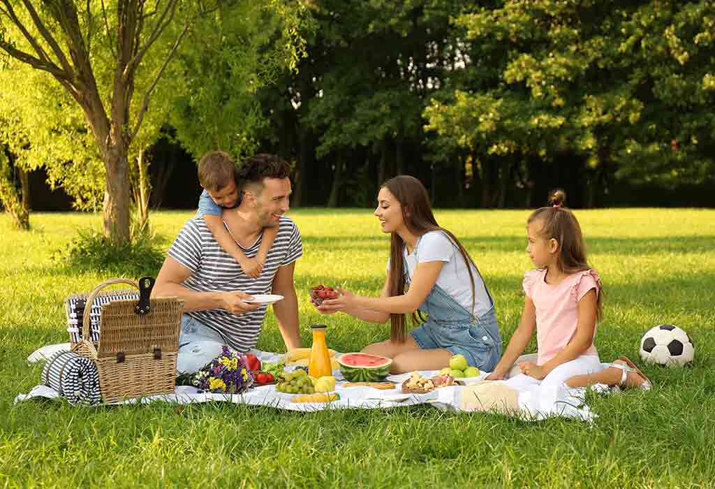 Happy family enjoying a picnic in the park